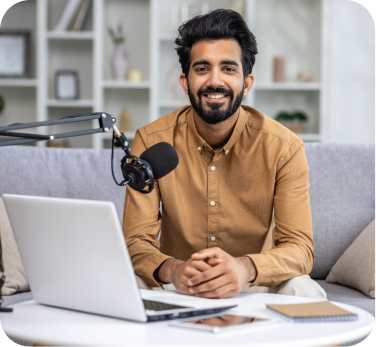 Creator recording a podcast at desk